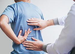doctor consulting with patient back problems